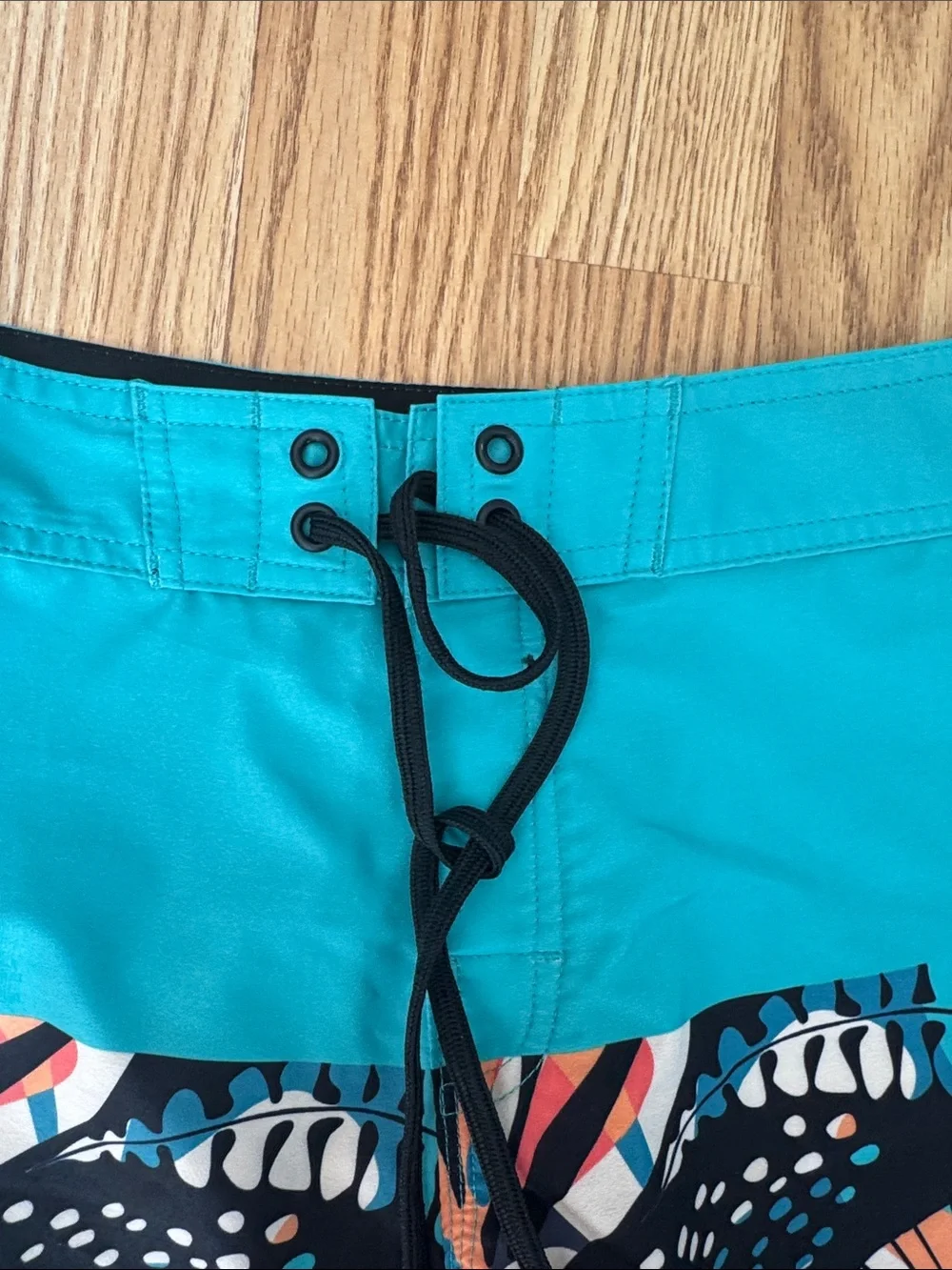 Youth Teal and Black Swim Trunks with Tropical Print